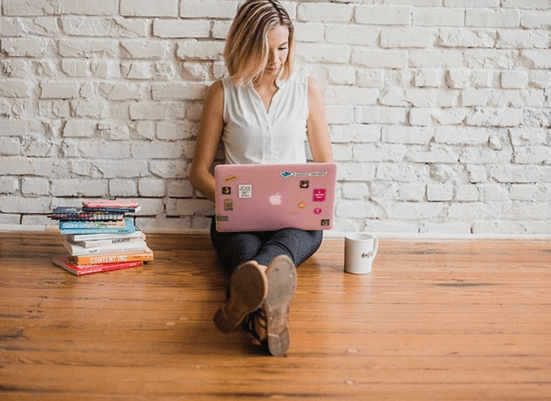 Woman typing on a laptop