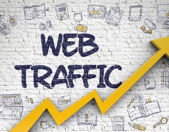 website traffic words on wall with arrow showing more traffic